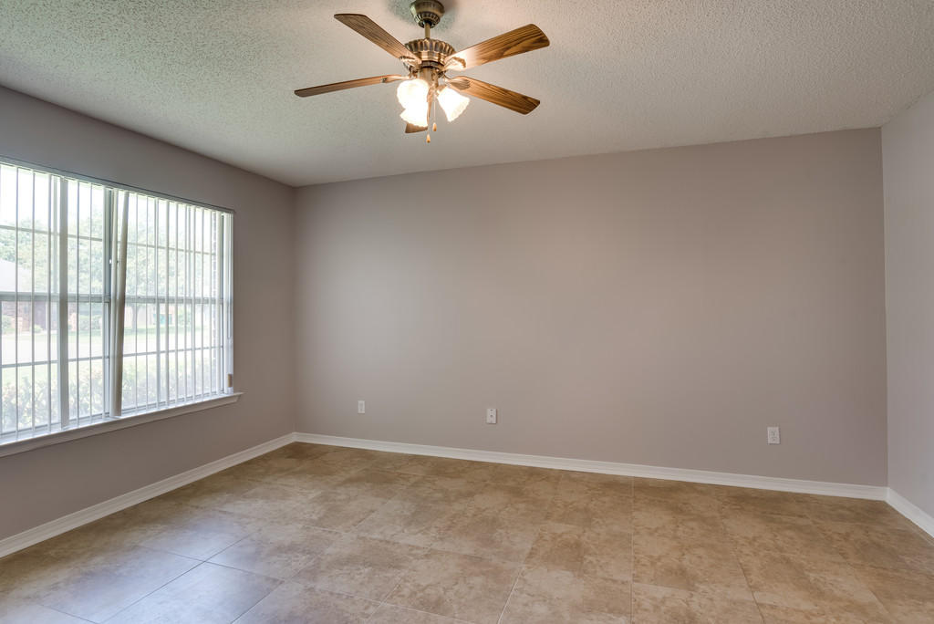 1969 Jessica Way Navarre, FL 32566 - Photo 8 of 17 an empty room with a window and a fan