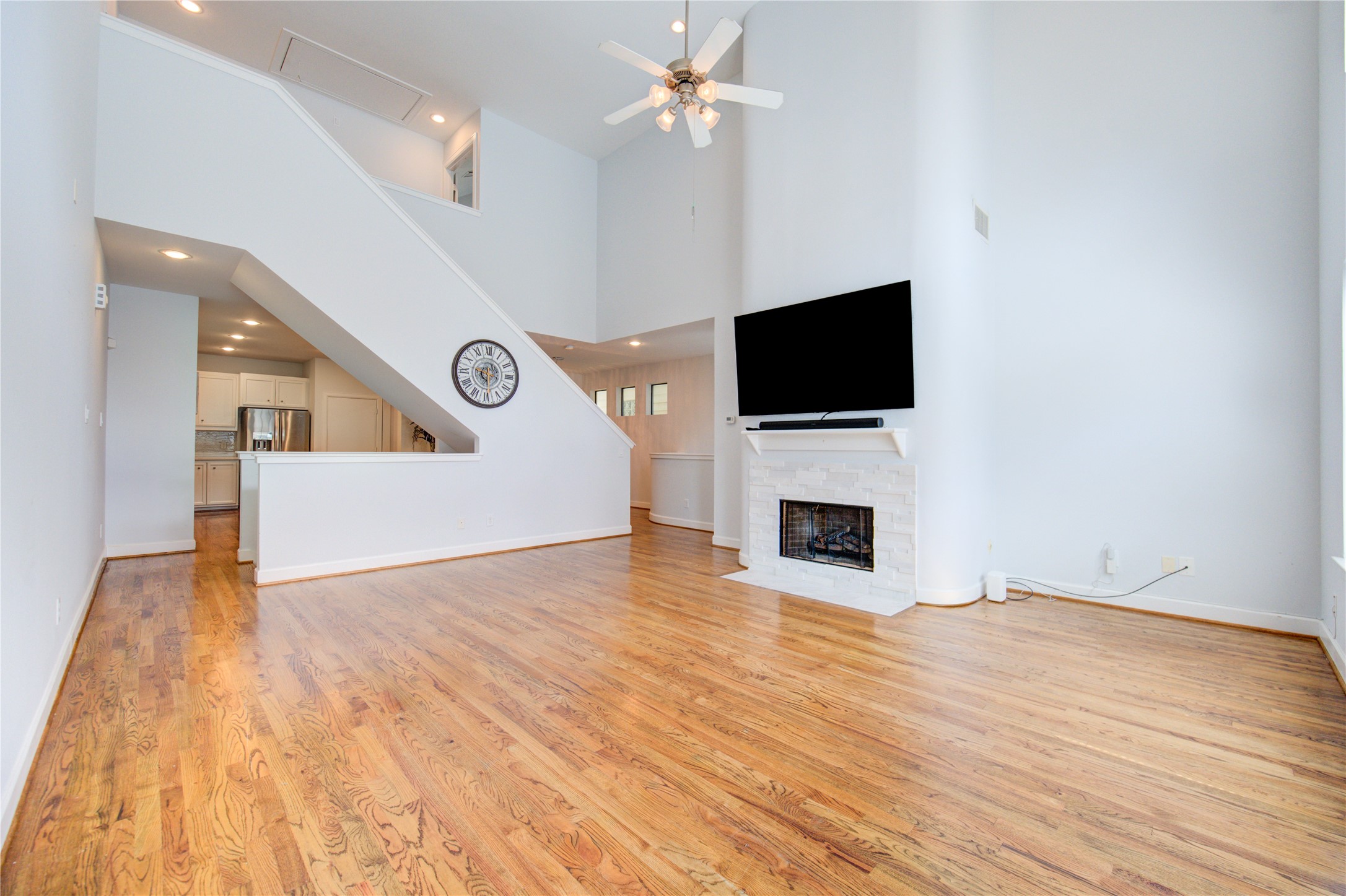 650 Westcross Street, Unit 83 Houston, TX 77018 - Photo 16 of 48 a view of livingroom with fireplace wooden floor and window