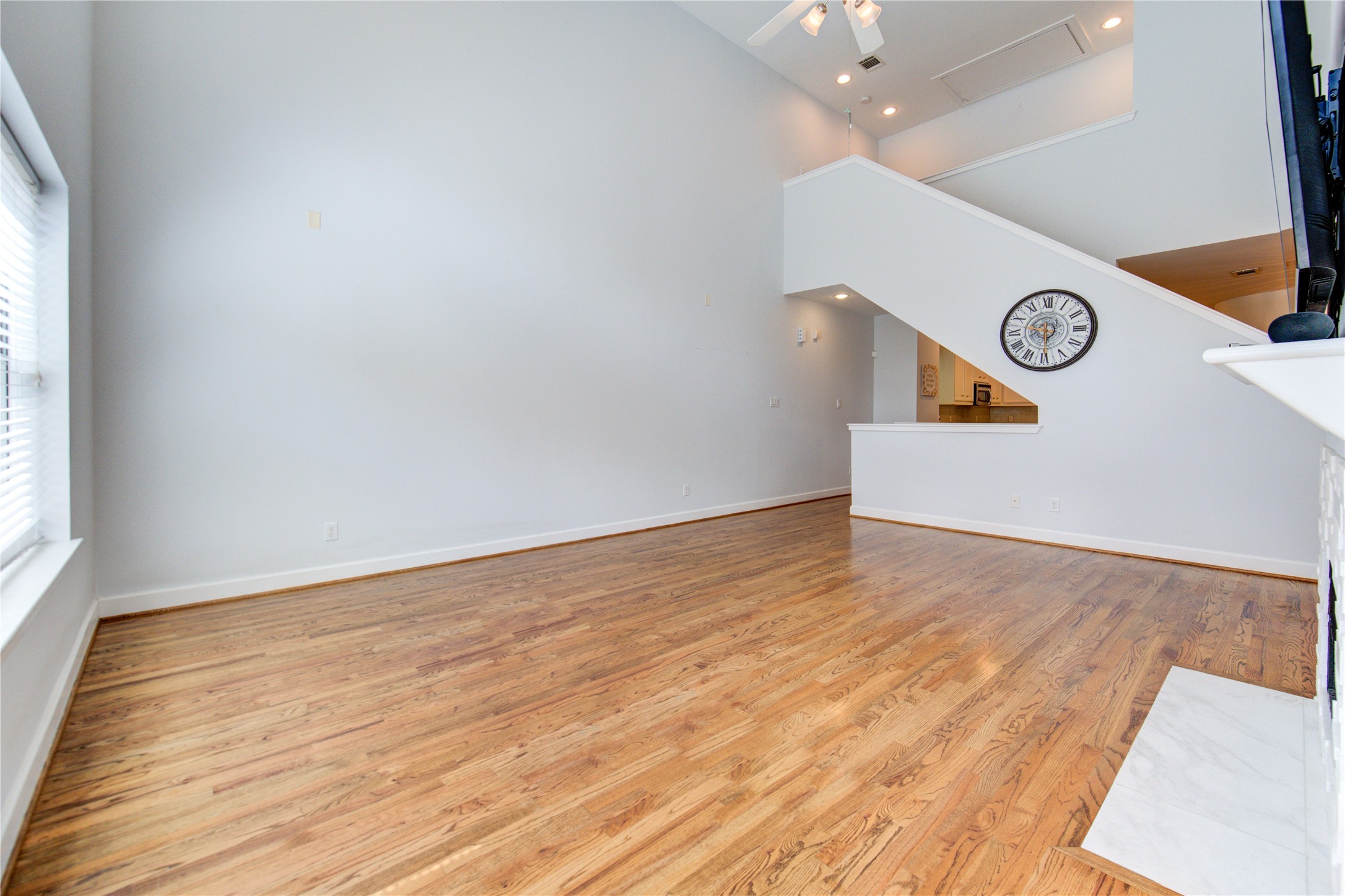 650 Westcross Street, Unit 83 Houston, TX 77018 - Photo 17 of 48 an empty room with wooden floor and door