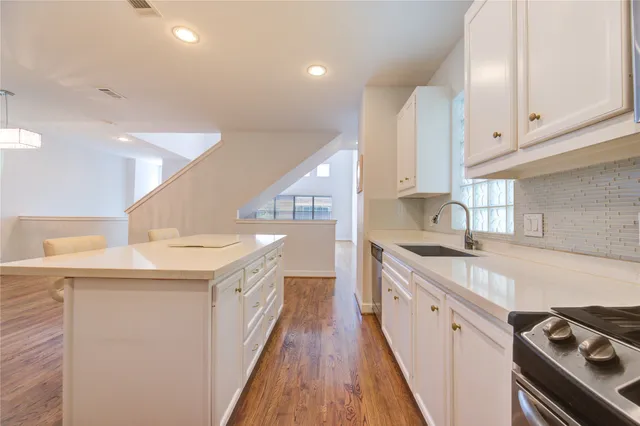 a view of a kitchen cabinets and wooden floor