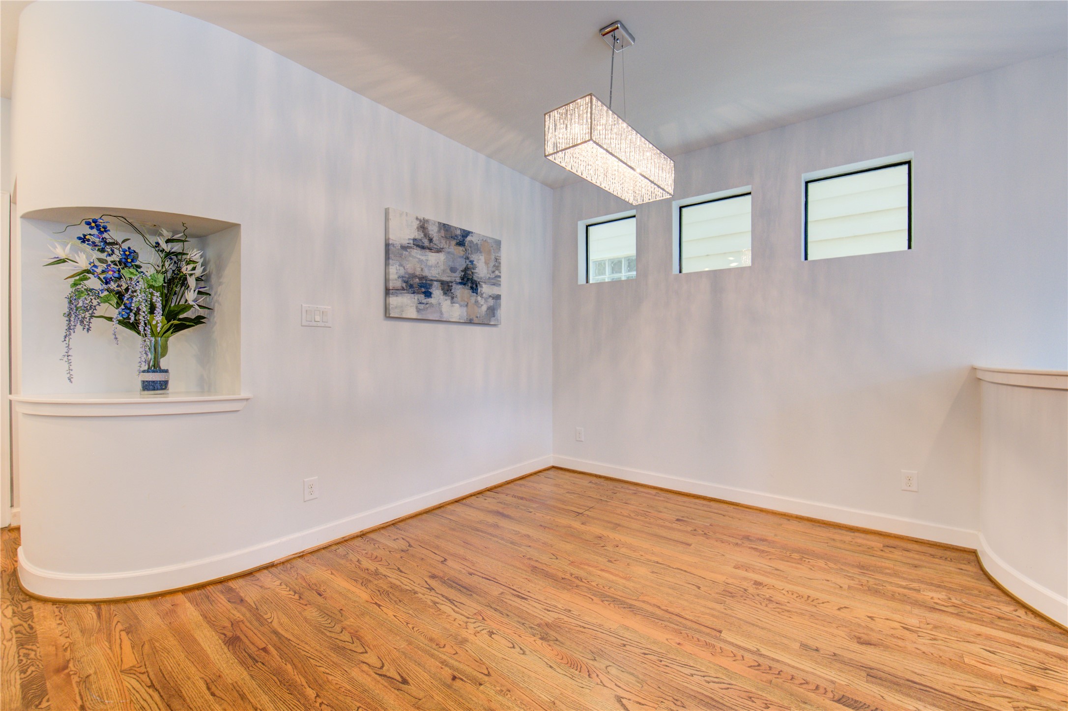 650 Westcross Street, Unit 83 Houston, TX 77018 - Photo 29 of 48 a view of empty room with wooden floor and fan