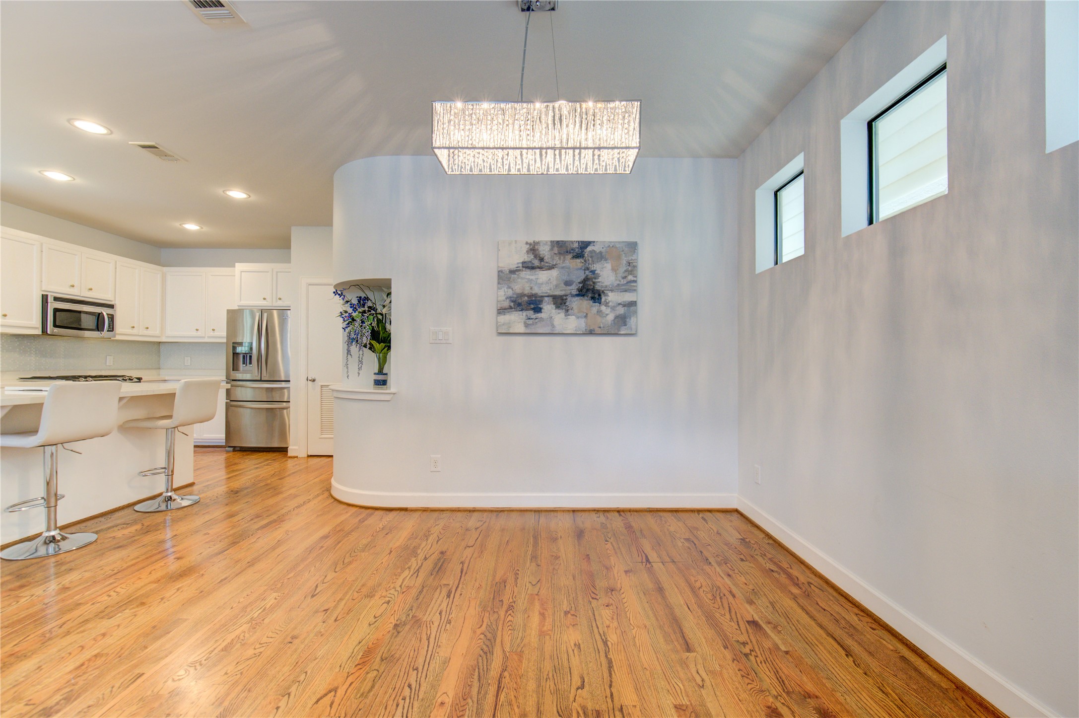 650 Westcross Street, Unit 83 Houston, TX 77018 - Photo 32 of 48 a view of empty room with wooden floor and window