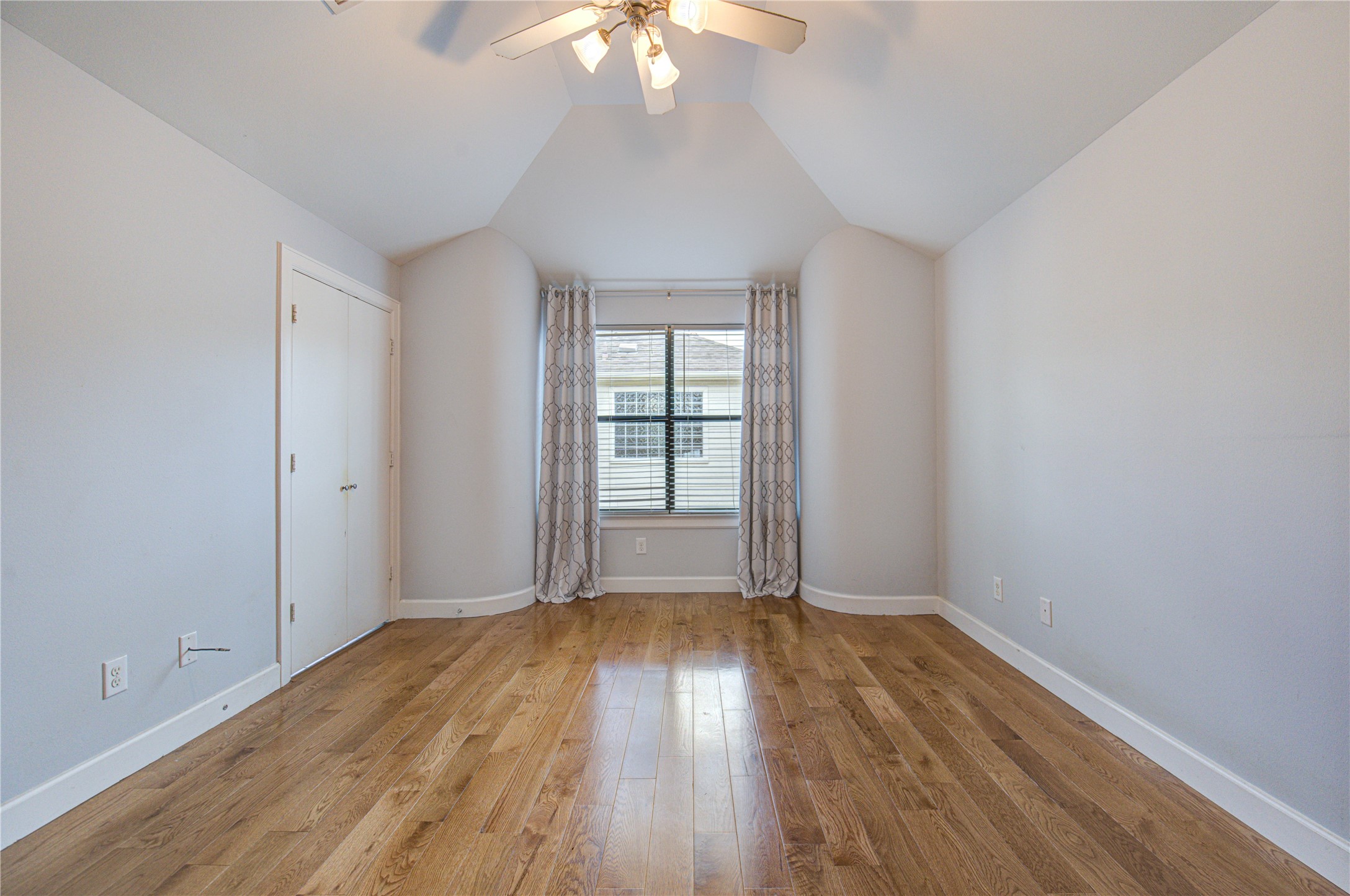 650 Westcross Street, Unit 83 Houston, TX 77018 - Photo 44 of 48 wooden floor in an empty room with a window