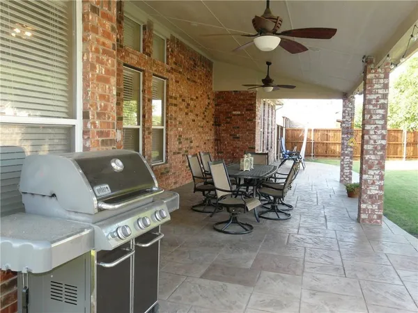 an outdoor space with garden view and sitting space