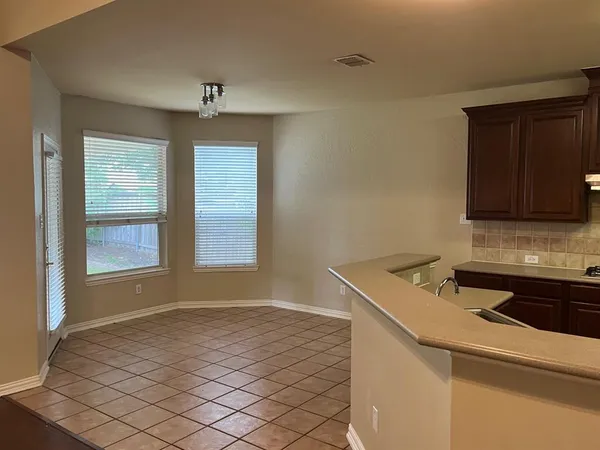a kitchen with a stove and a sink
