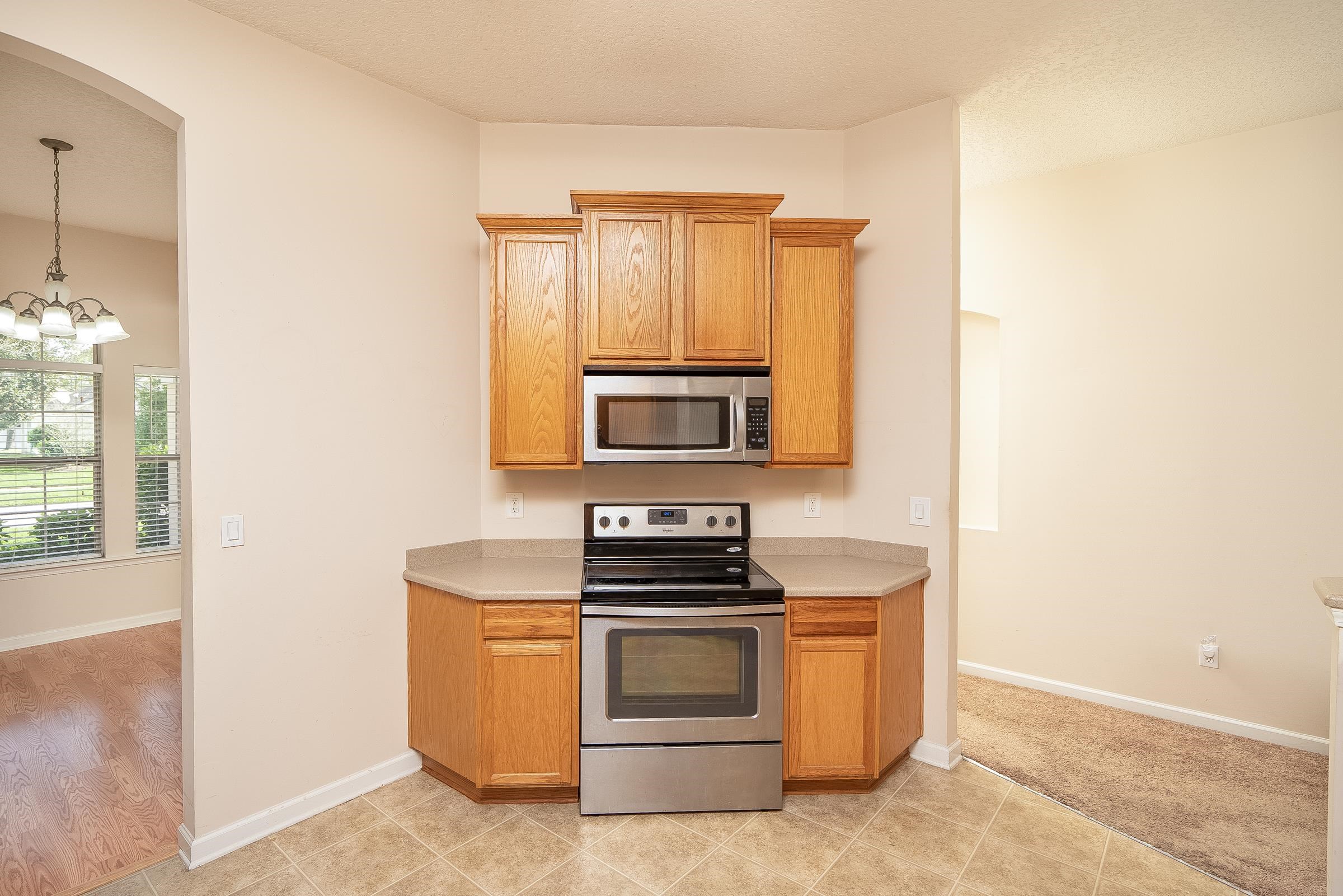 1525 Remington Way St. Augustine, FL 32084 - Photo 16 of 51 a kitchen with a stove and a microwave