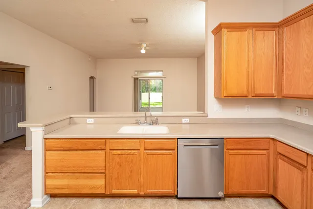 an empty room with closet and a bathroom