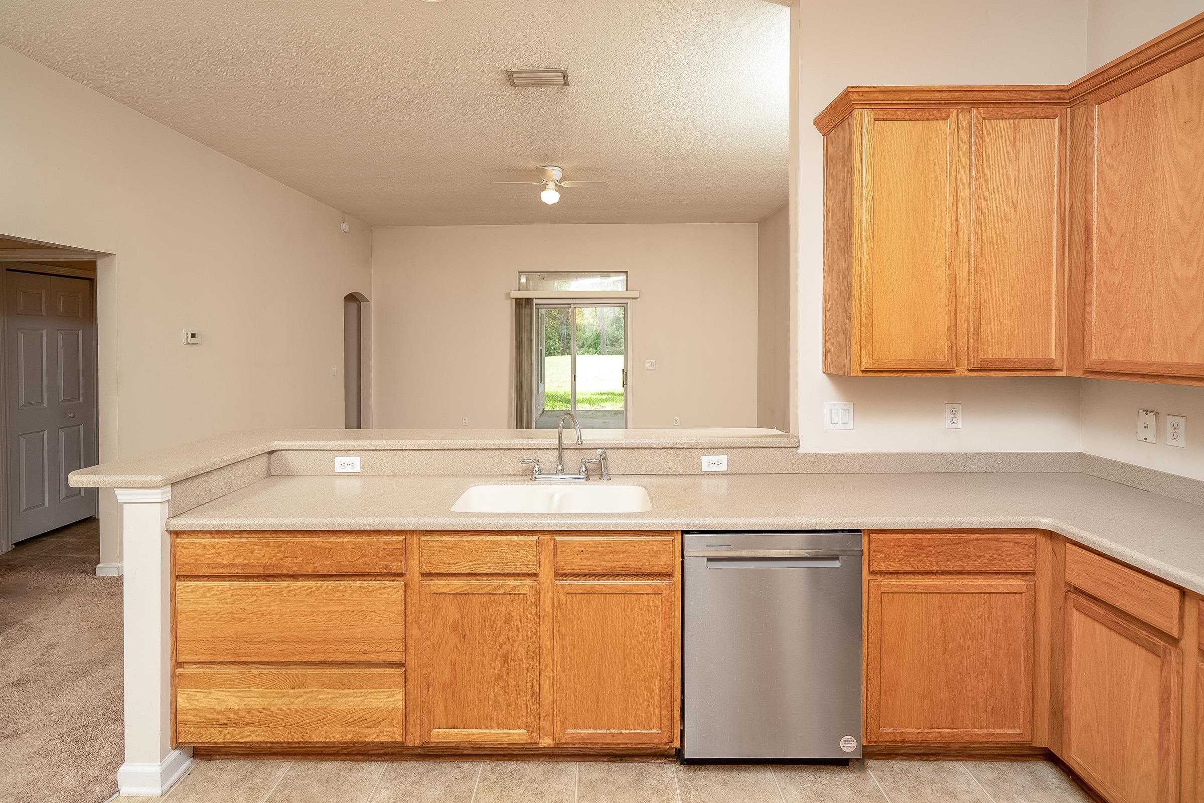1525 Remington Way St. Augustine, FL 32084 - Photo 17 of 51 a kitchen with cabinets and window