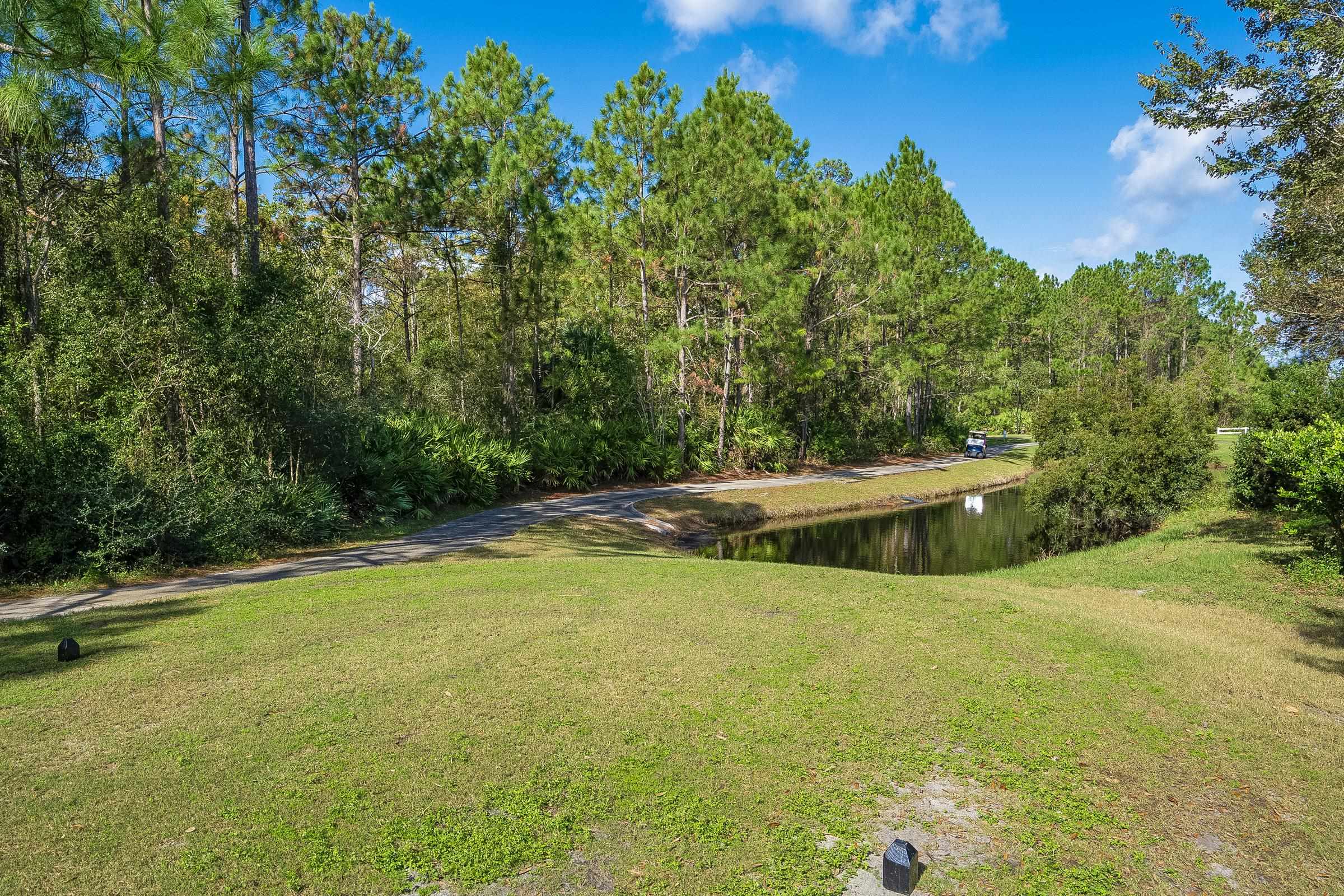 1525 Remington Way St. Augustine, FL 32084 - Photo 24 of 51 a view of a swimming pool with an outdoor seating and a yard