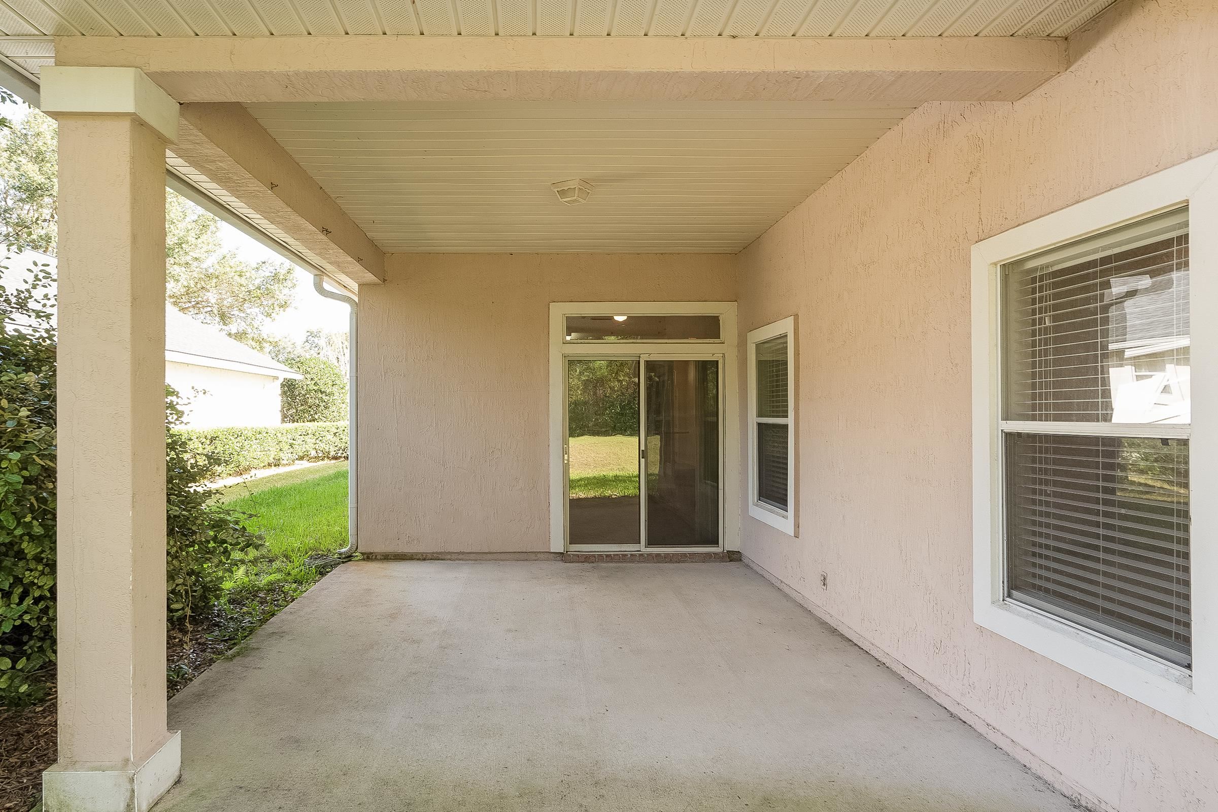 1525 Remington Way St. Augustine, FL 32084 - Photo 25 of 51 a view of an empty room with large windows