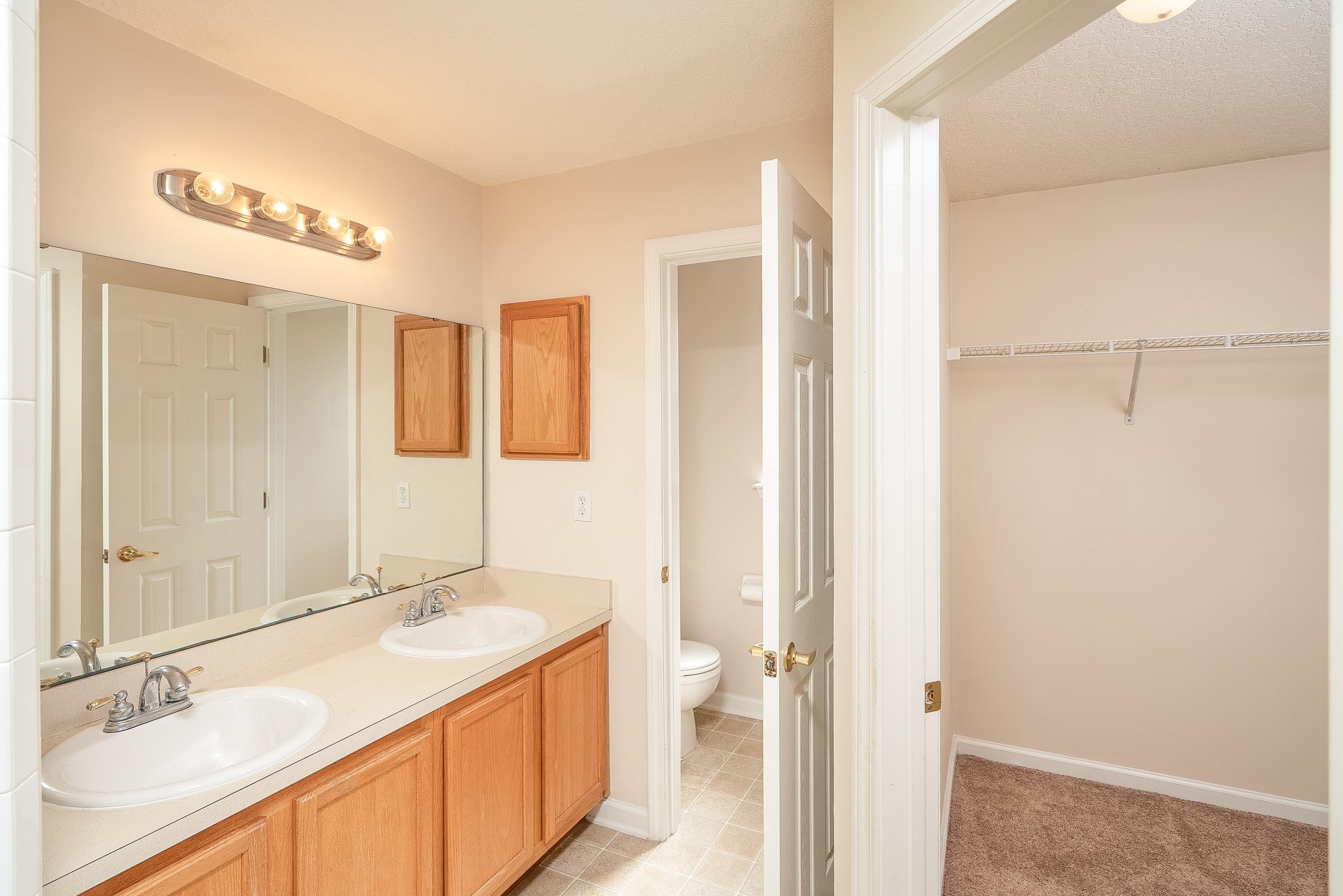 1525 Remington Way St. Augustine, FL 32084 - Photo 39 of 51 a bathroom with a sink and a mirror
