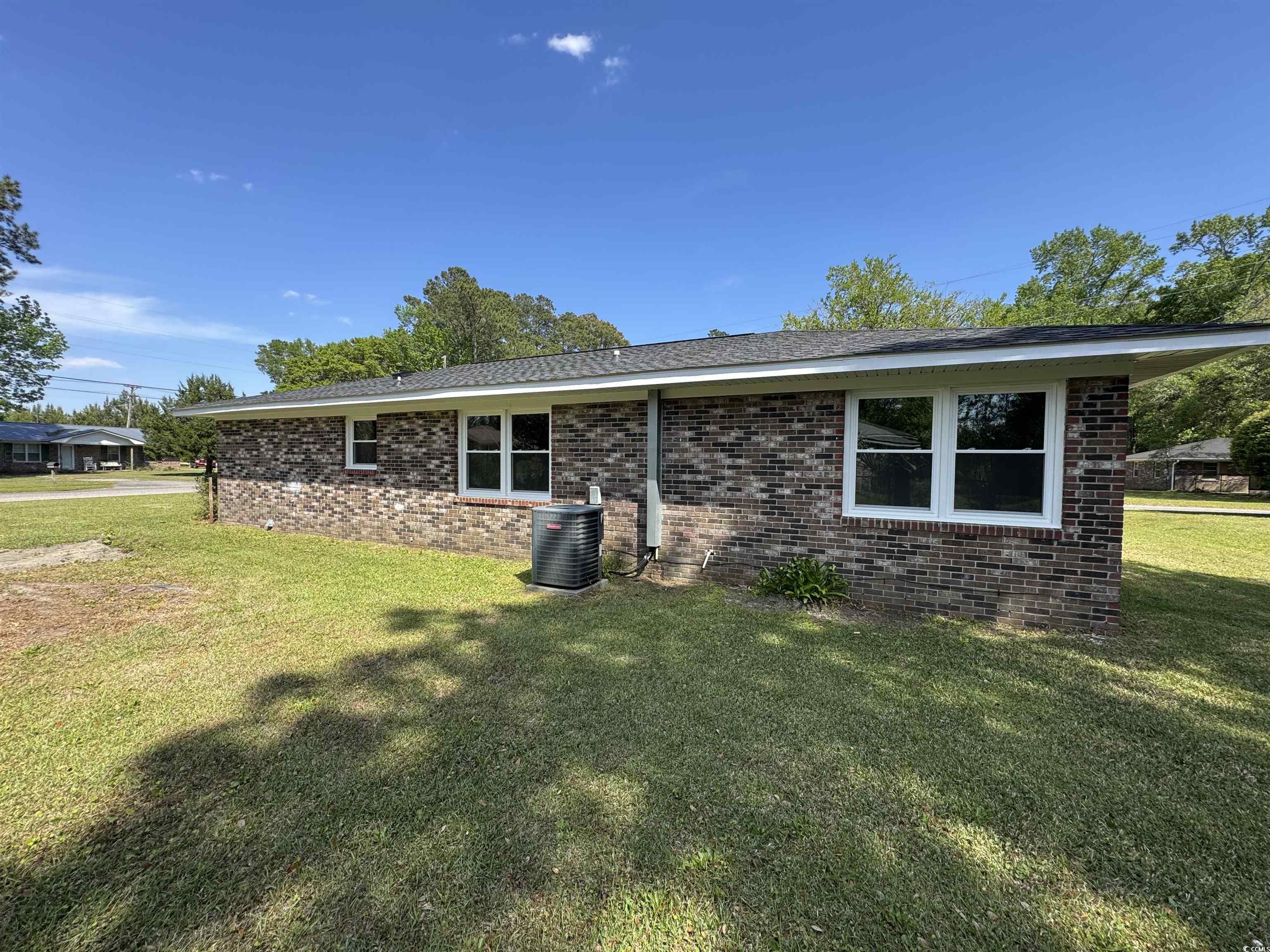 333 Whites Creek Road Georgetown, SC 29440 - Photo 11 of 13 Rear view of property featuring brick siding, a la