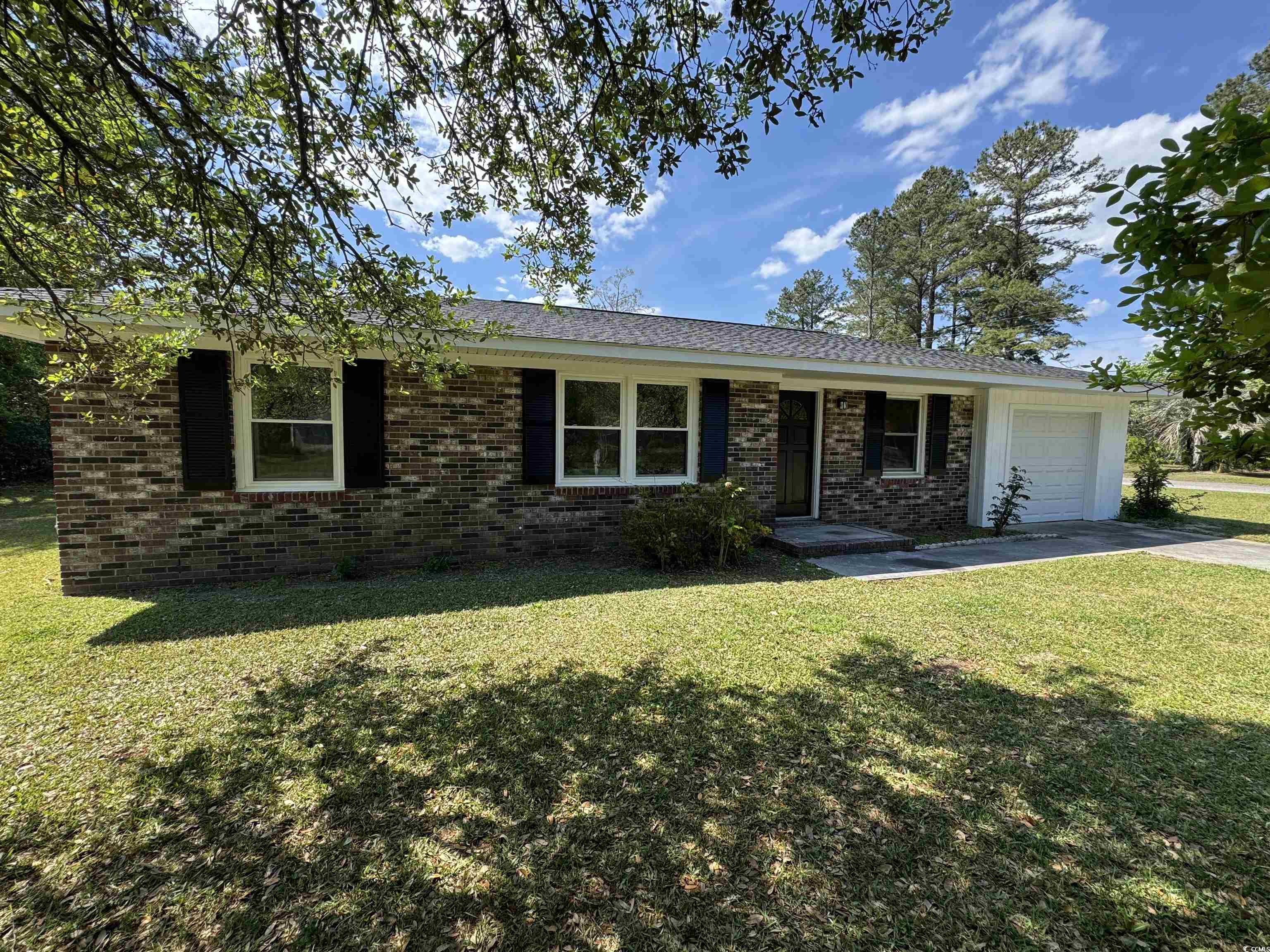 333 Whites Creek Road Georgetown, SC 29440 - Photo 12 of 13 Ranch-style home with a front lawn, brick siding,