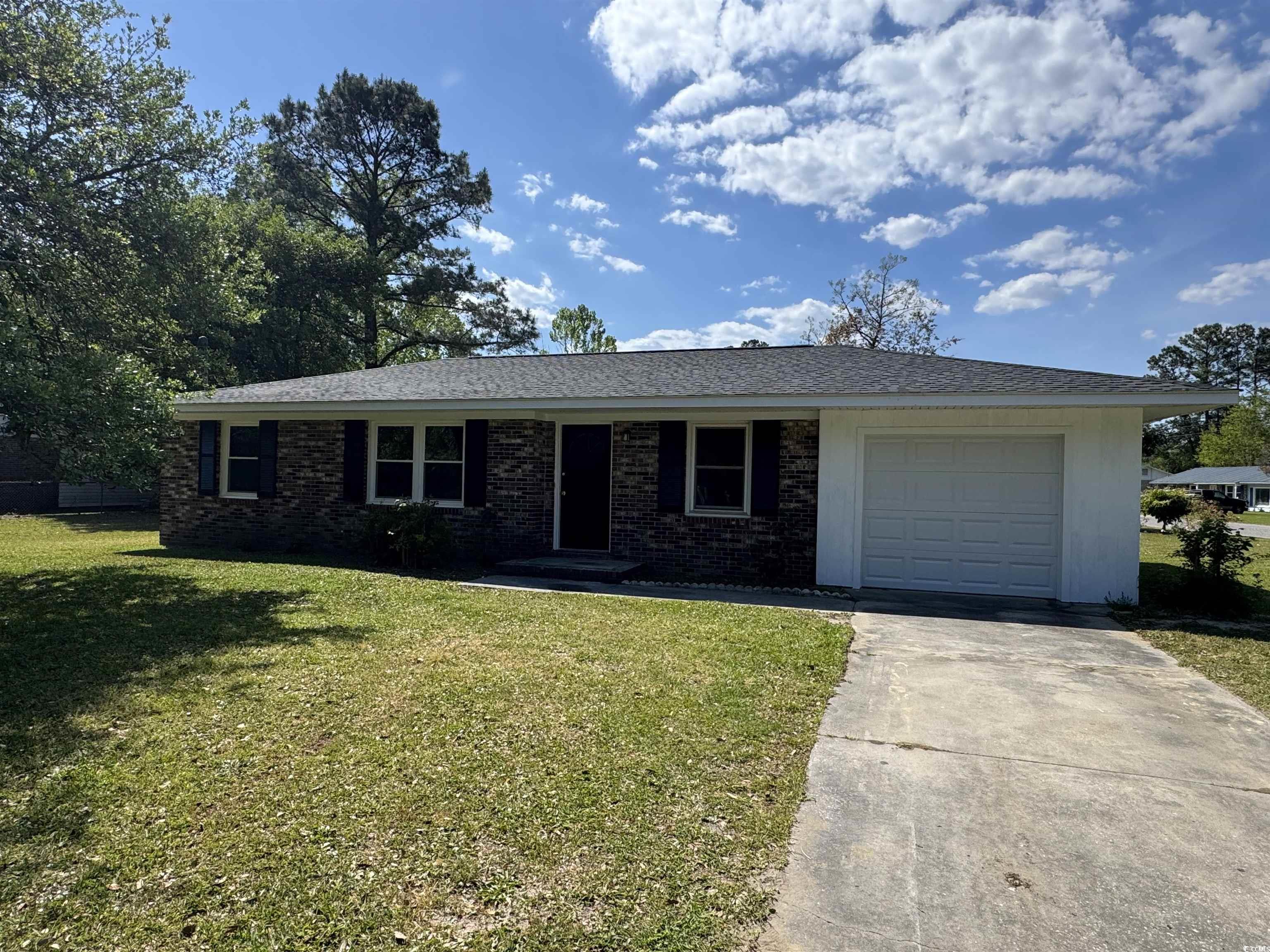 333 Whites Creek Road Georgetown, SC 29440 - Photo 13 of 13 Ranch-style house with brick siding, driveway, a f