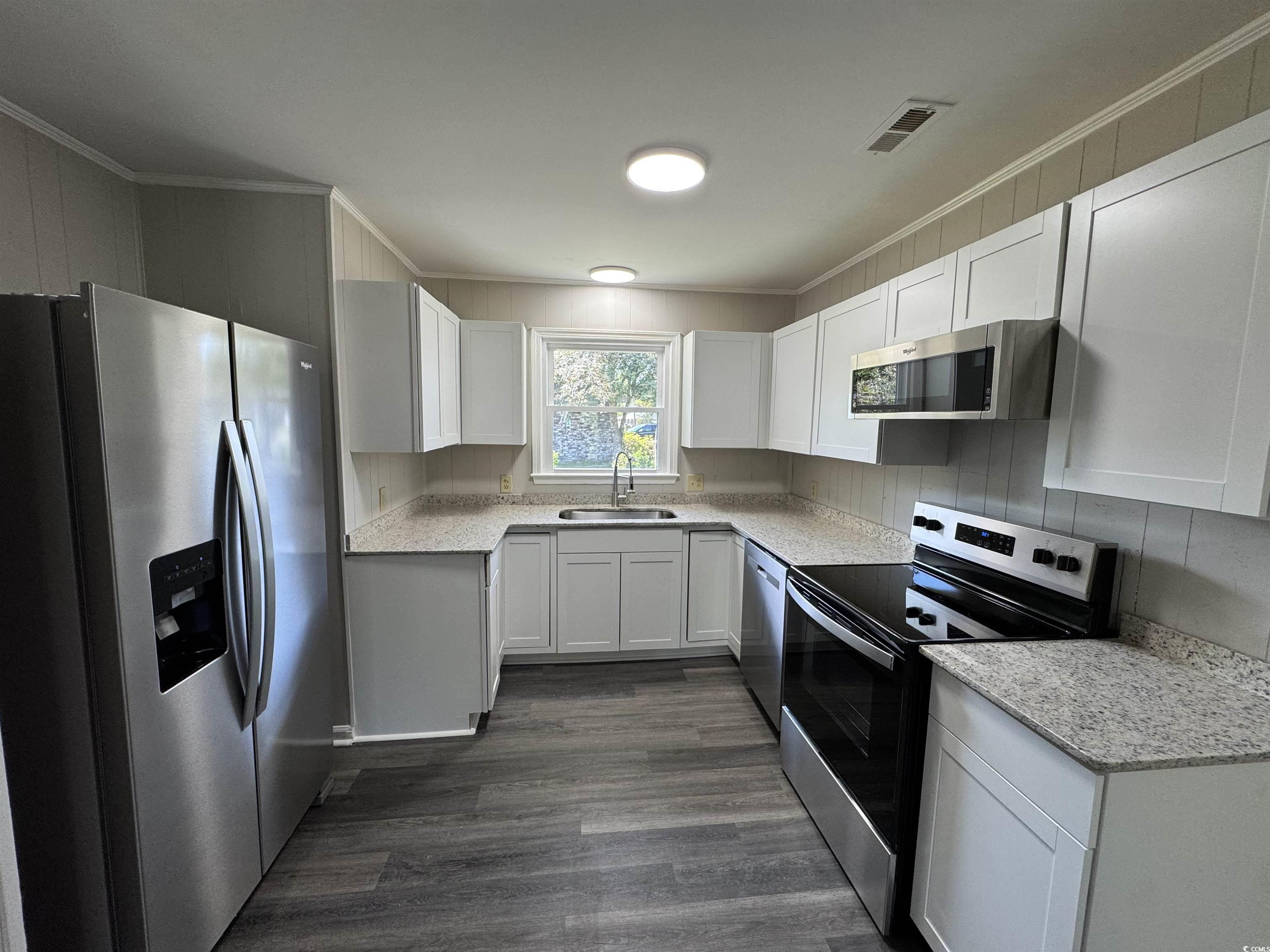 333 Whites Creek Road Georgetown, SC 29440 - Photo 3 of 13 Kitchen featuring dark wood finished floors, appli