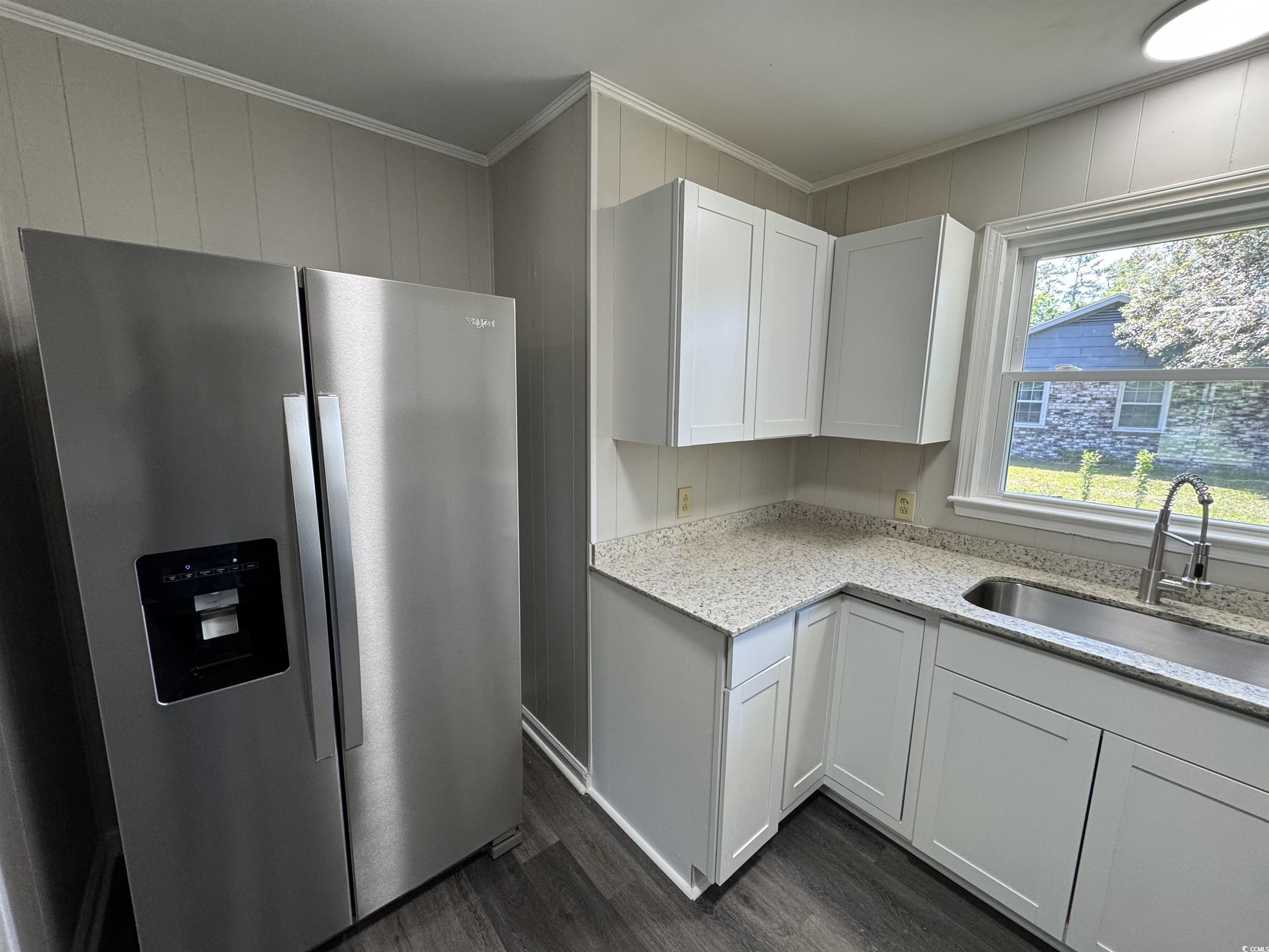 333 Whites Creek Road Georgetown, SC 29440 - Photo 5 of 13 Kitchen with a sink, light stone counters, crown m