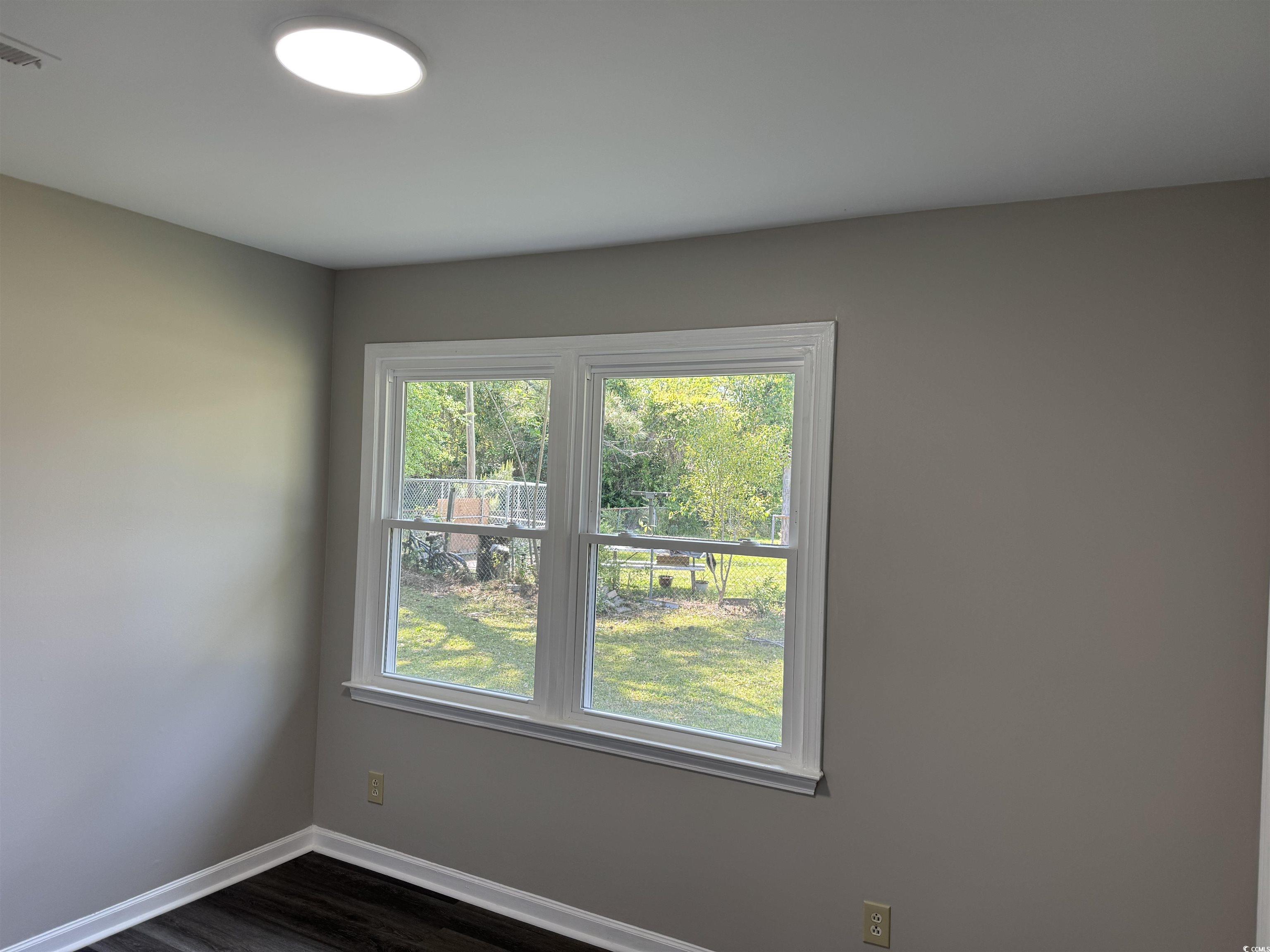333 Whites Creek Road Georgetown, SC 29440 - Photo 8 of 13 Unfurnished room featuring dark wood-type flooring