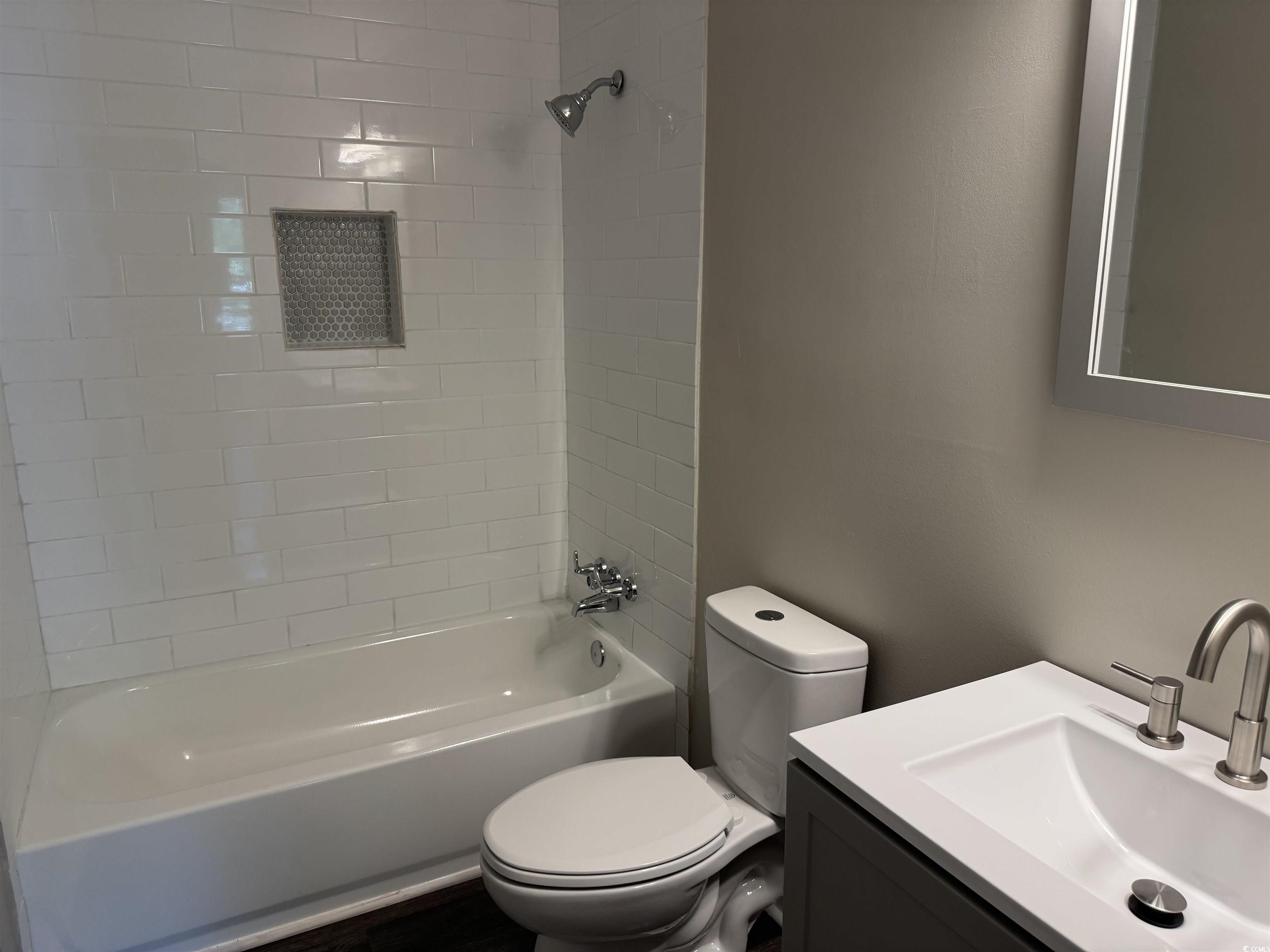 333 Whites Creek Road Georgetown, SC 29440 - Photo 9 of 13 Bathroom featuring toilet, vanity, and shower / ba