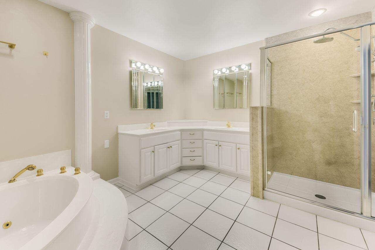 3030 South 130th Street New Berlin, WI 53151 - Photo 11 of 17 Primary bath featuring dual vanities, soaking tub and shower.