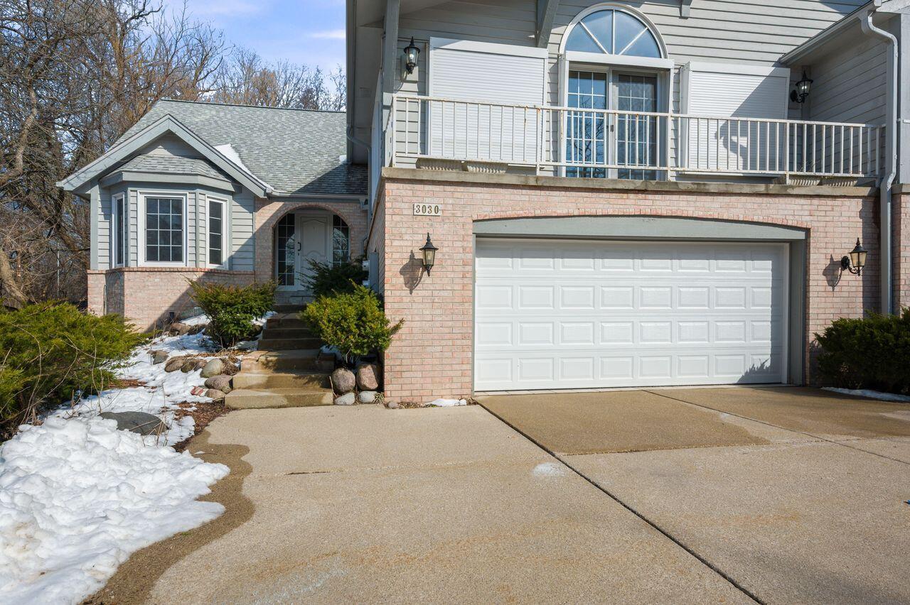 3030 South 130th Street New Berlin, WI 53151 - Photo 3 of 17 Front entrance with a wide driveway and attached garage.
