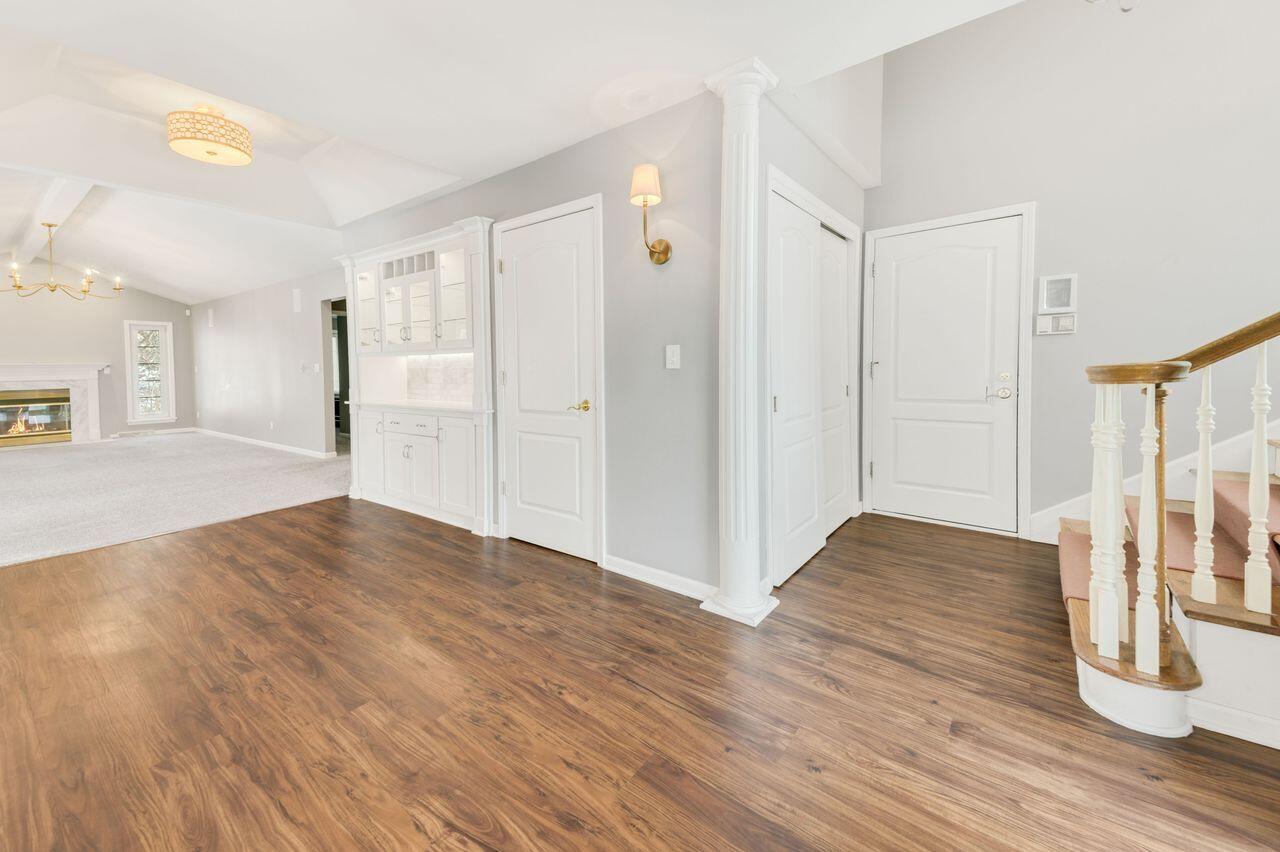 3030 South 130th Street New Berlin, WI 53151 - Photo 4 of 17 Bright entryway with warm wood flooring.