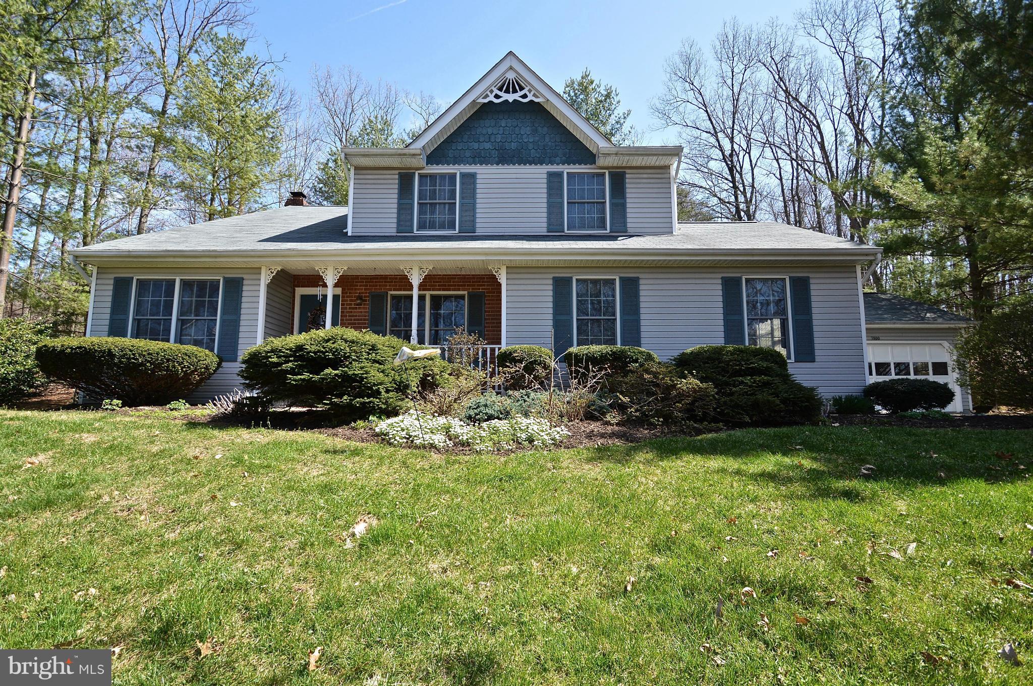 3800 Roop Road New Windsor, MD 21776 - Photo 1 of 29 a front view of a house with a yard and trees