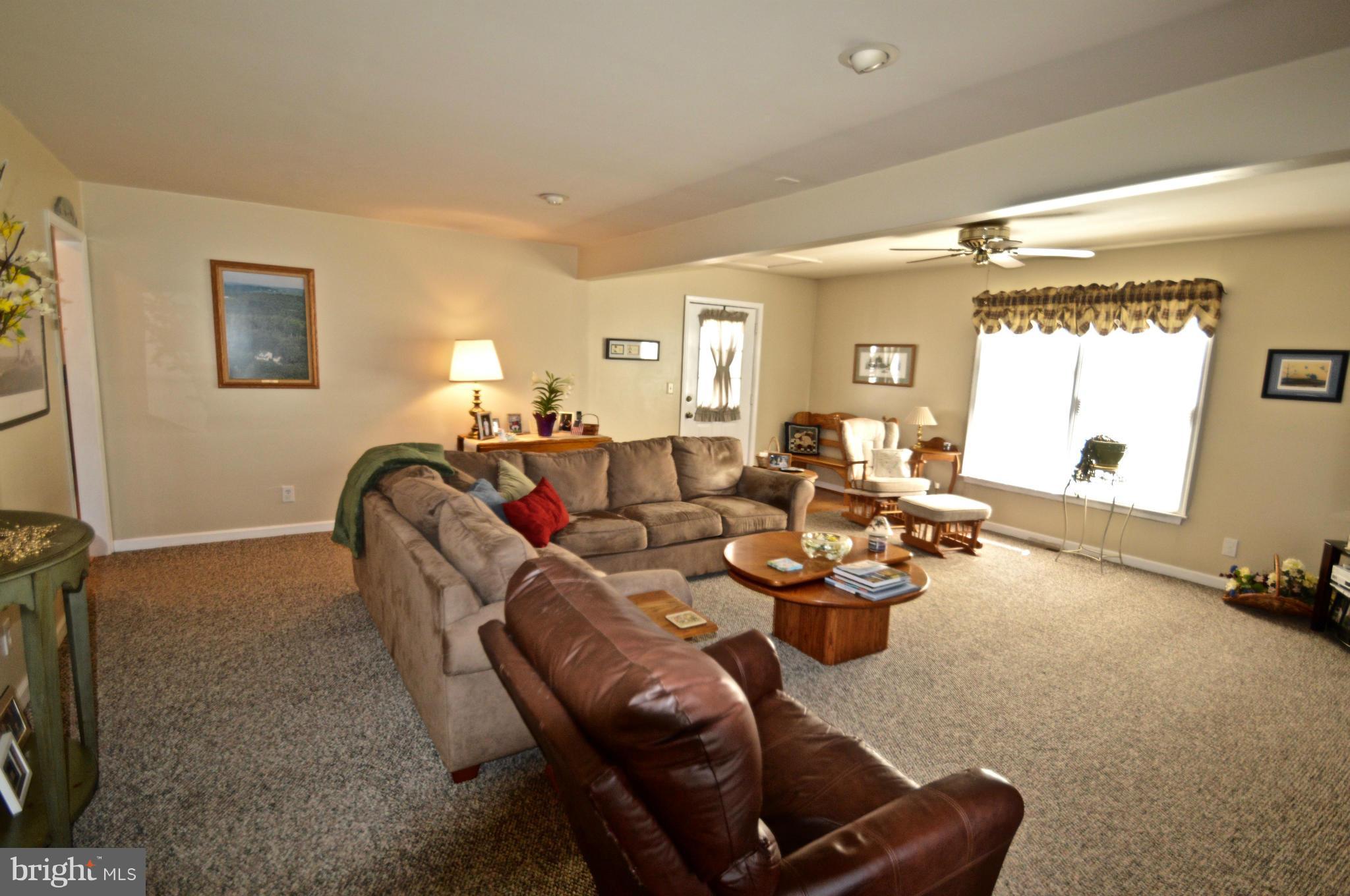3800 Roop Road New Windsor, MD 21776 - Photo 11 of 29 a living room with furniture and a large window