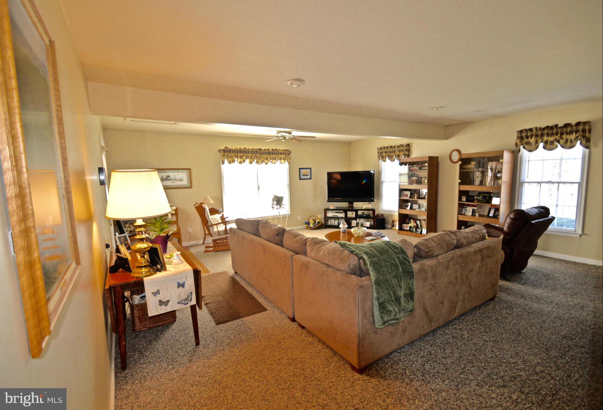 3800 Roop Road New Windsor, MD 21776 - Photo 12 of 29 a living room with furniture and a flat screen tv