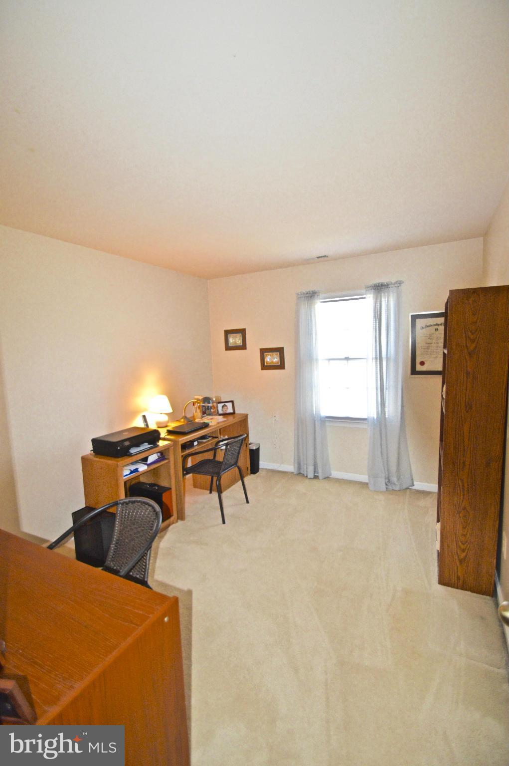 3800 Roop Road New Windsor, MD 21776 - Photo 20 of 29 a living room with furniture a window and a table