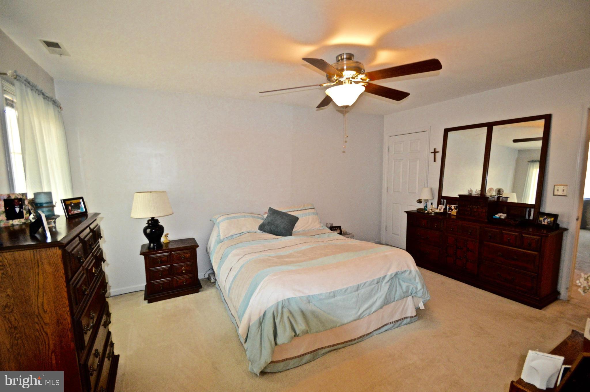 3800 Roop Road New Windsor, MD 21776 - Photo 22 of 29 a bedroom with a bed and a mirror