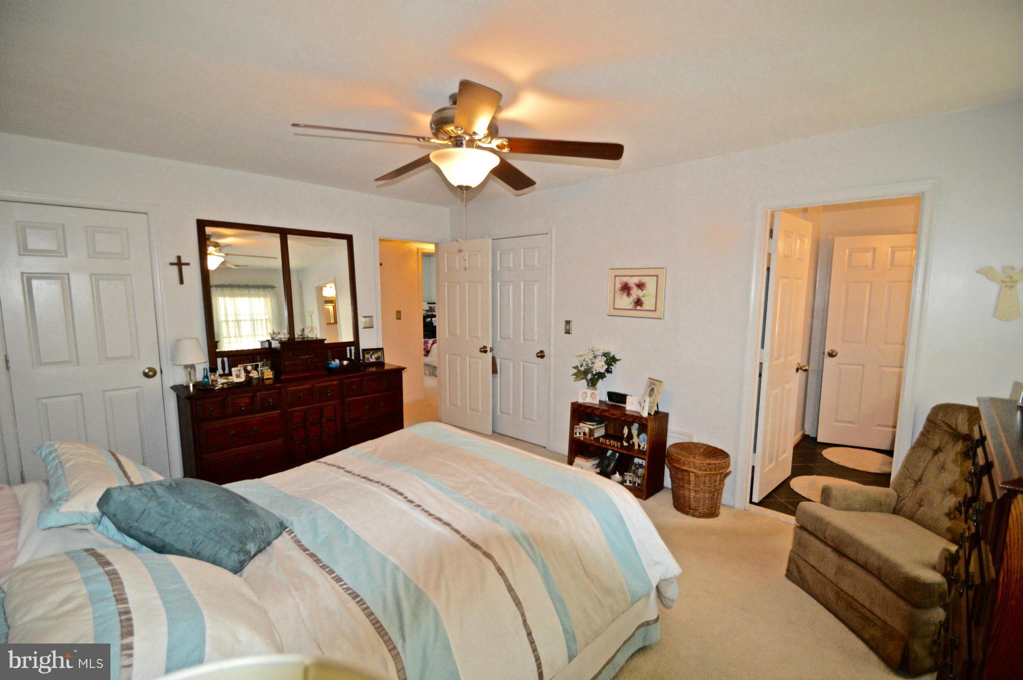 3800 Roop Road New Windsor, MD 21776 - Photo 23 of 29 a bed room with a bed and a chandelier
