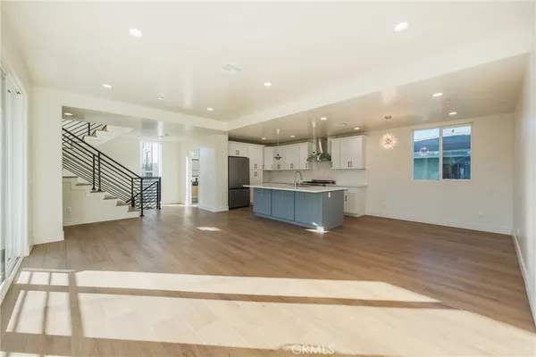 a view of kitchen and kitchen with furniture wooden floor and window