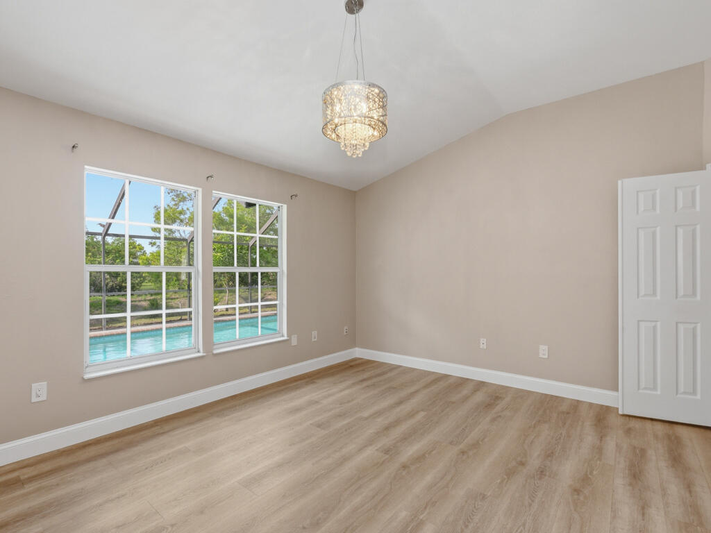 3650 Kent Drive Naples, FL 34112 - Photo 14 of 17 a view of an empty room with a window