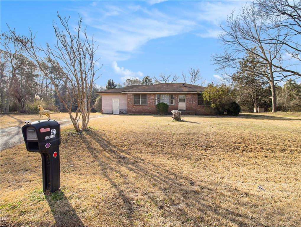 420 Boynton Road Hampton, GA 30228 - Photo 1 of 1 a front view of a house with a yard