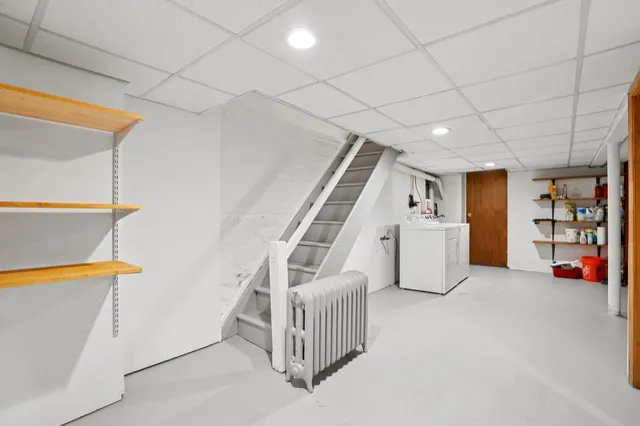 a view of an empty room with stairs