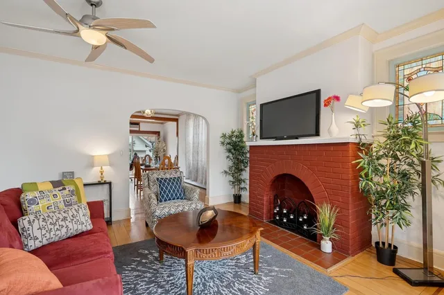 a living room with furniture and a fireplace
