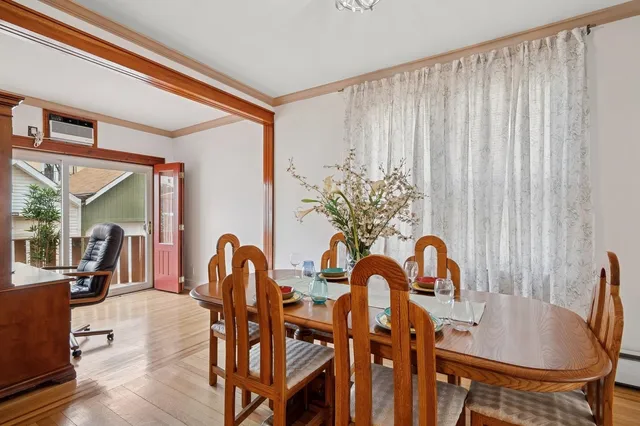 a dining room with furniture and chandelier kitchen view