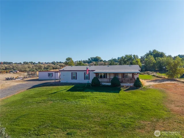 a view of a house with a big yard