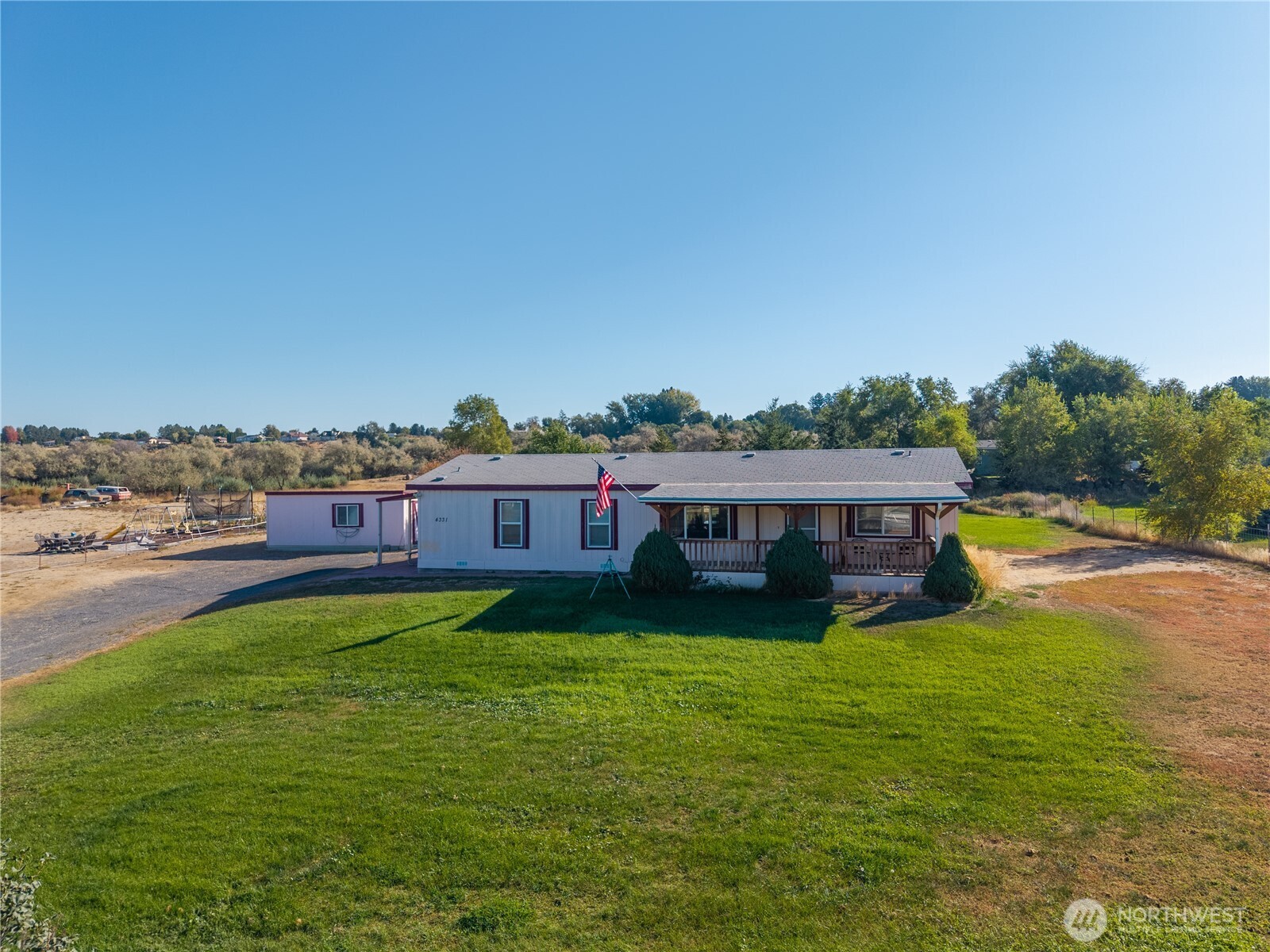 a view of a house with a big yard