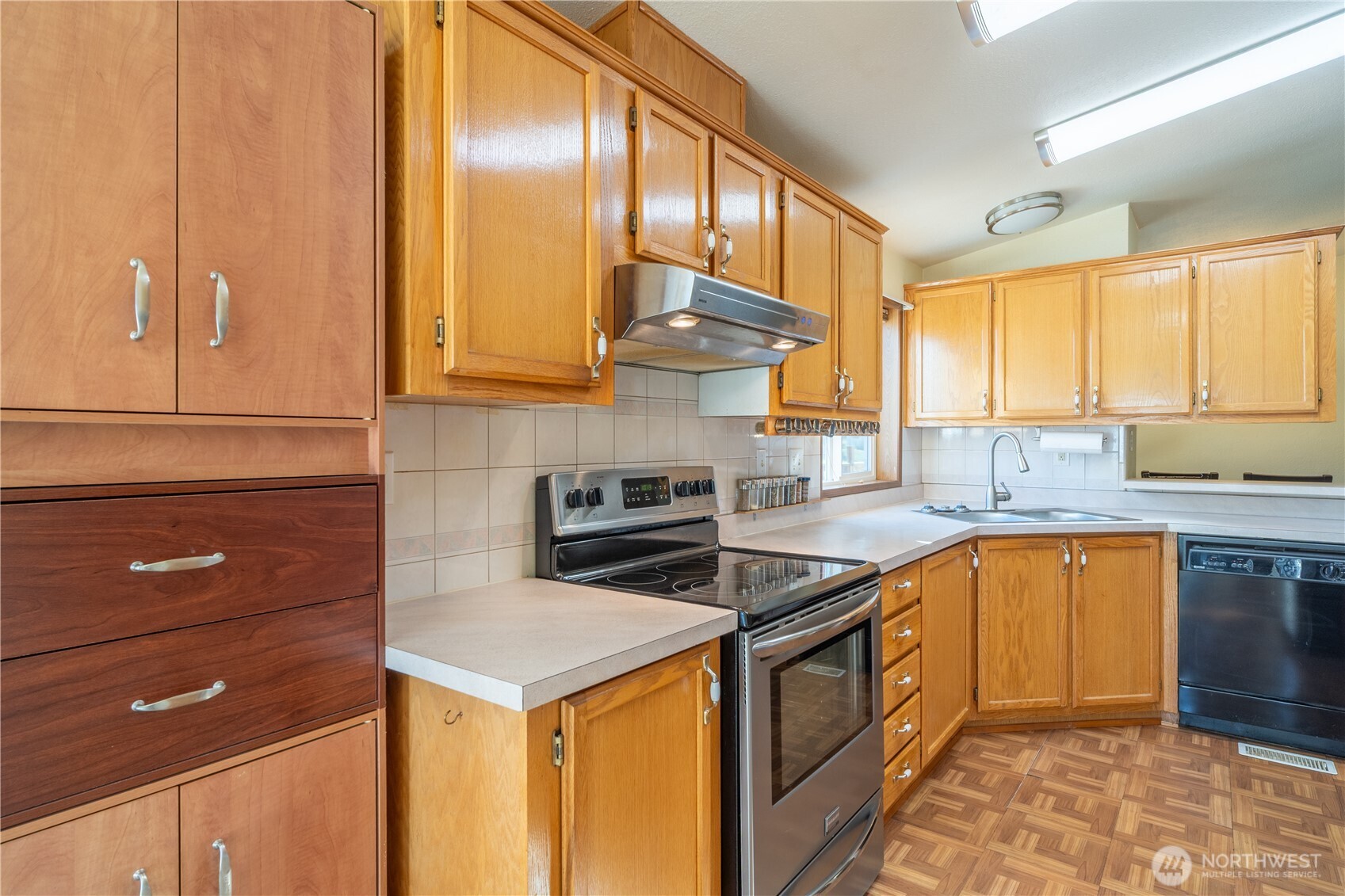 4331 Rd K 2 Street Northeast Moses Lake, WA 98837 - Photo 14 of 38 a kitchen with stainless steel appliances granite countertop a sink stove and cabinets