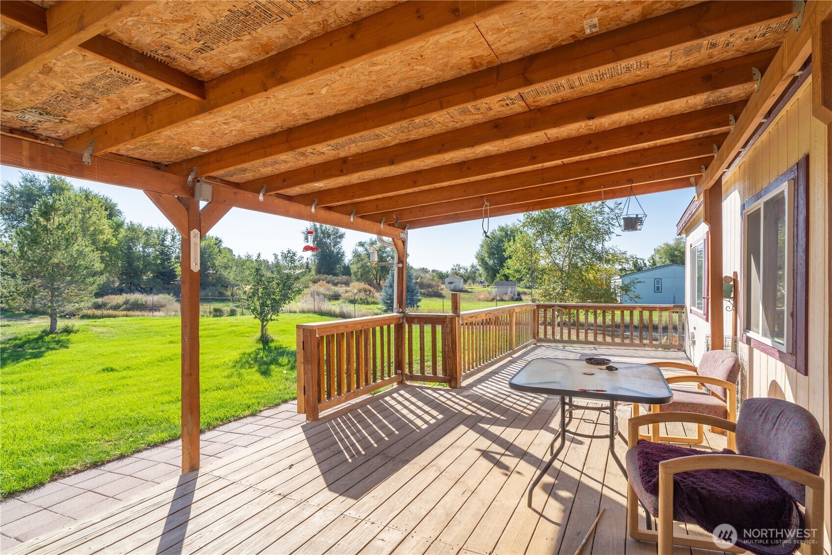 4331 Rd K 2 Street Northeast Moses Lake, WA 98837 - Photo 29 of 38 a view of a patio with a table chairs and a backyard
