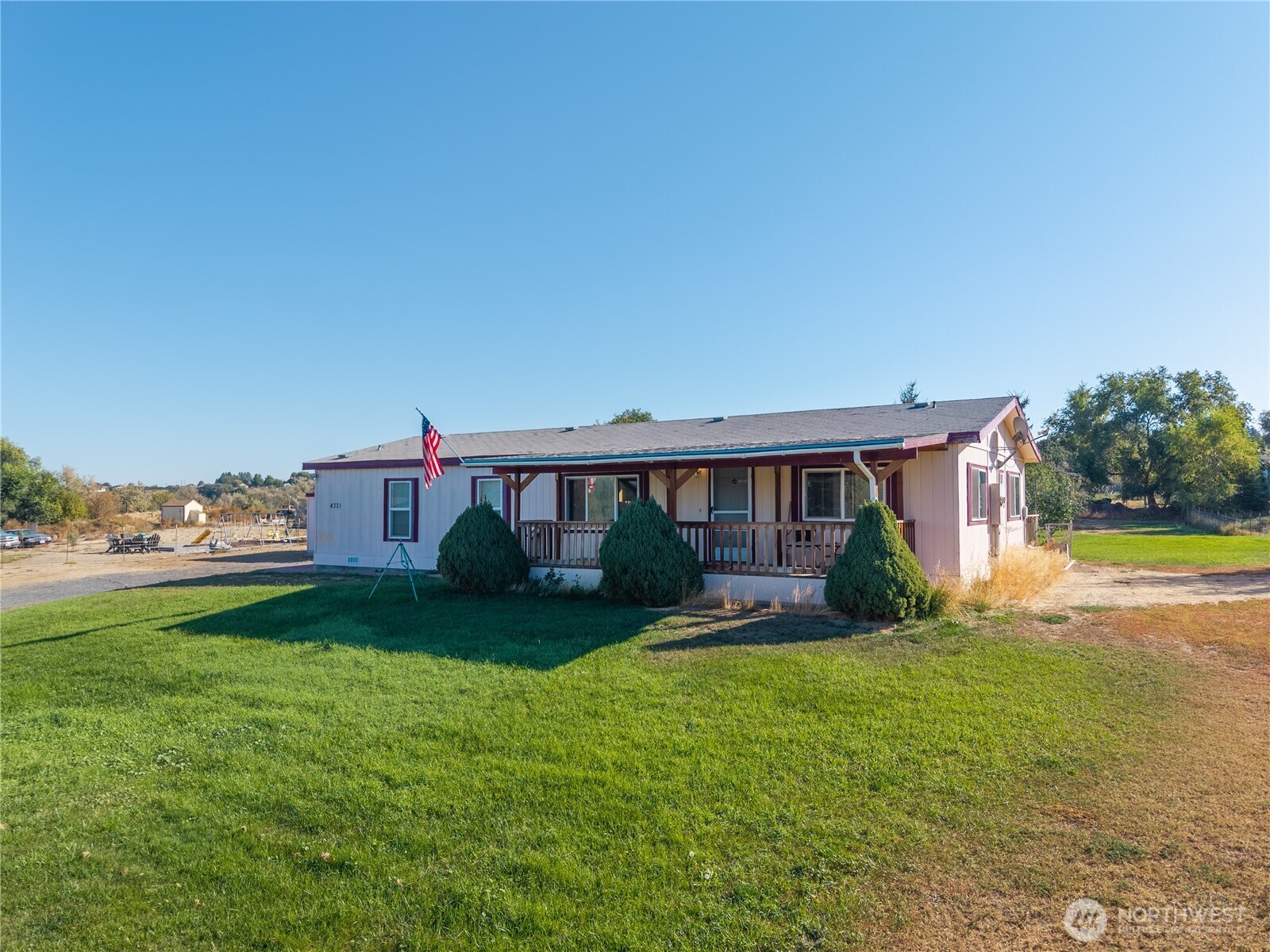 4331 Rd K 2 Street Northeast Moses Lake, WA 98837 - Photo 3 of 38 a view of a house with a yard and a porch