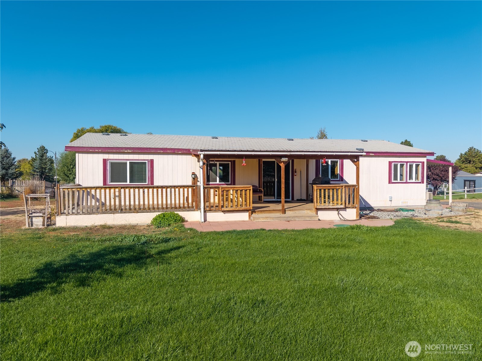4331 Rd K 2 Street Northeast Moses Lake, WA 98837 - Photo 5 of 38 a view of a house with patio and a yard