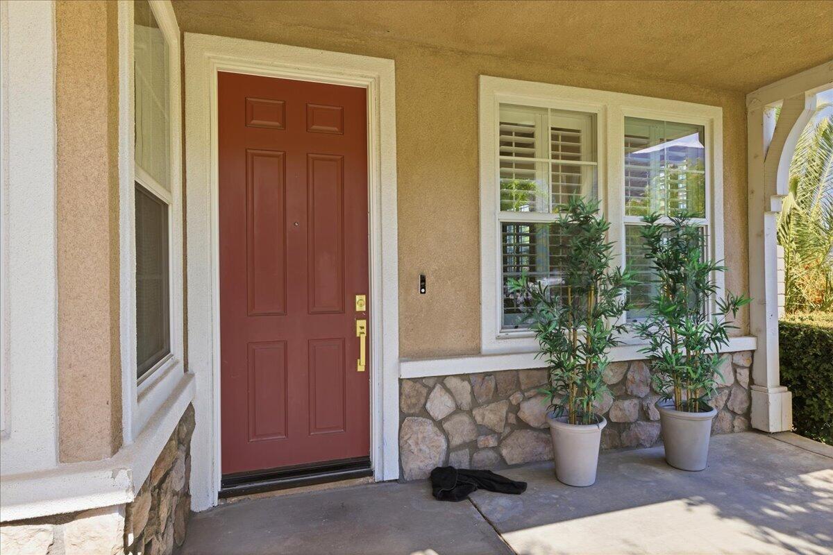 23732 Bella Vista Road Corona, CA 92883 - Photo 5 of 49 a view of a porch with furniture and garden
