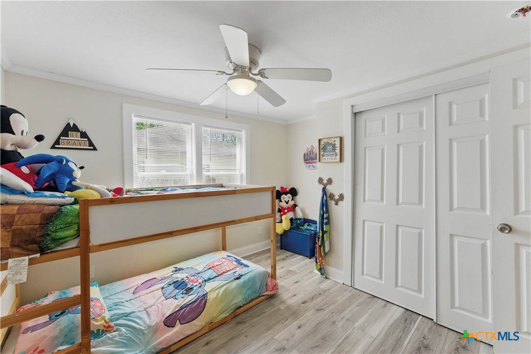 411 Ellis Street Seguin, TX 78155 - Photo 17 of 28 a bedroom with furniture and a window