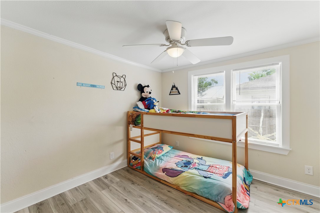 411 Ellis Street Seguin, TX 78155 - Photo 18 of 28 a bedroom with a bed and a window