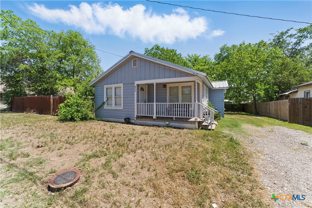 411 Ellis Street Seguin, TX 78155 - Photo 2 of 28 a view of a house with a yard