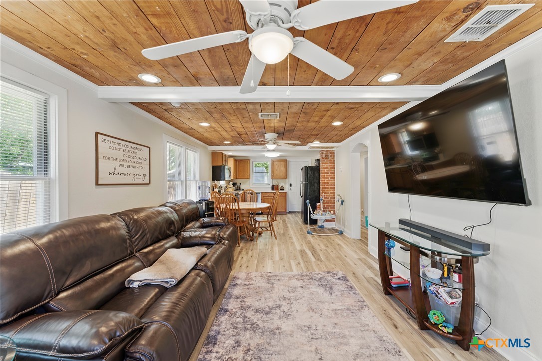 411 Ellis Street Seguin, TX 78155 - Photo 4 of 28 a living room with furniture and a flat screen tv
