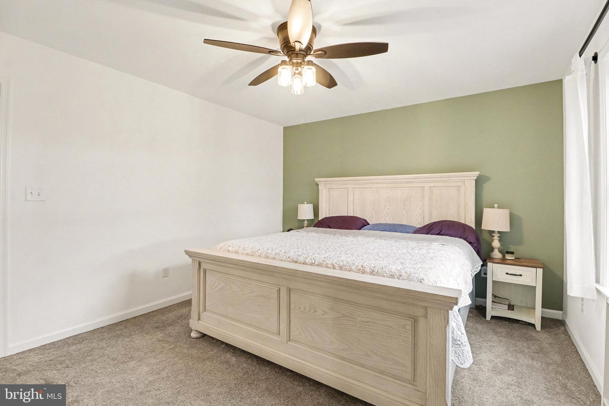 1296 Bower Road Shermans Dale, PA 17090 - Photo 19 of 43 a bedroom with a bed and a ceiling fan