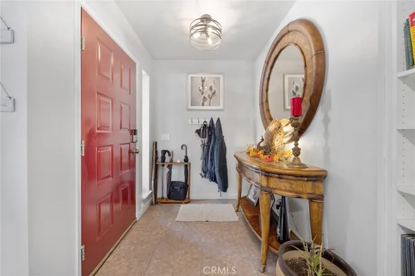 a living room with furniture and a kitchen view